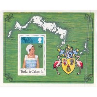 TURKS E CAICOS - 1977 - MINT - BLOCO - VISITA REAL POR OCASIÃO DO 25º ANIVERSÁRIO DA ASCENSÃO AO TRONO DA RAINHA ELIZABETH II - RETRATO E BRASÃO DE TURKS E CAICOS AO LADO DO SELO - YT-BL-7