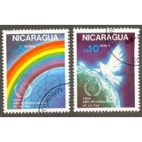 NICARÁGUA - Y A-1149/50 DO ANO ANO 1986- ANO INTERNACIONAL DA PAZ - POMBA DA PAZ, GLOBO TERRESTRE E ARCO IRIS - SÉRIE 2 SELOS USADOS